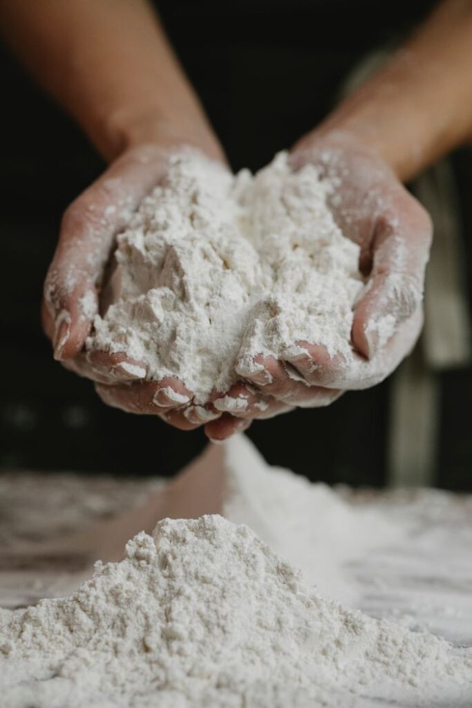 The Art of Drawing Readers In: Your attractive post title goes here Crop anonymous female preparing and showing white clean flour in hands in kitchen
